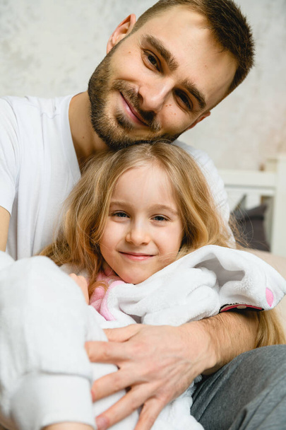 Lovely portrait of young father and daughter, close-up. - Photo, Image