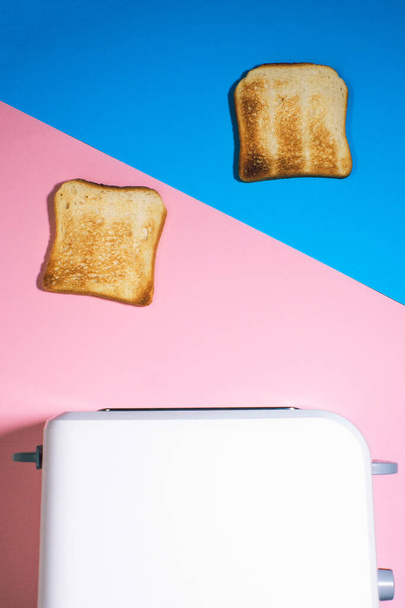 toaster with toasted bread for Breakfast. vertical photo Flat lay - Fotó, kép