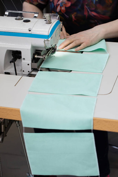 Each piece of fabric has to go through the entire production process from design through cutting to sewing. - Foto, afbeelding