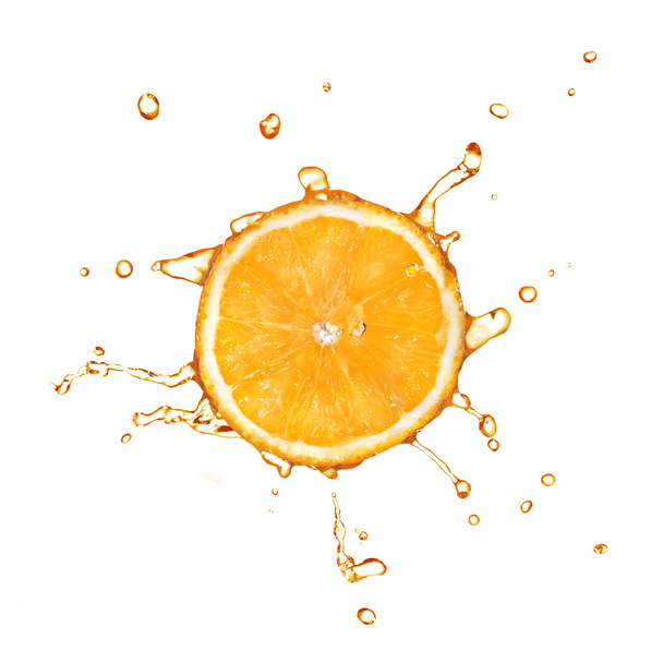 Slice of orange with juice splash isolated on white - Foto, Imagem