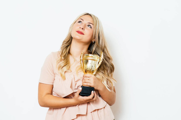 Woman with a golden cup - Foto, Imagen