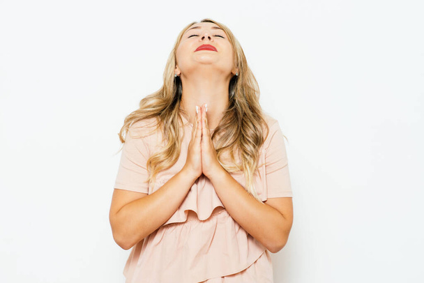 Prayer. Female. against studio background - Foto, Imagem