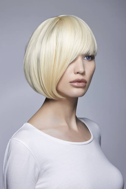 fashion beauty portrait of young woman with stylish bob haircut. beautiful blond girl - 写真・画像