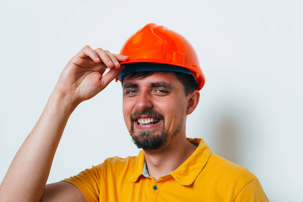man close-up in helmet , holding his head by hand - Foto, immagini