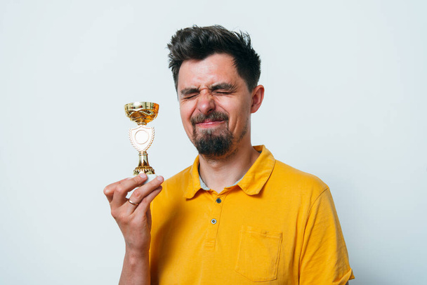 man with a golden cup - Zdjęcie, obraz