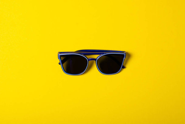 Blue sunglasses fashion - Фото, изображение