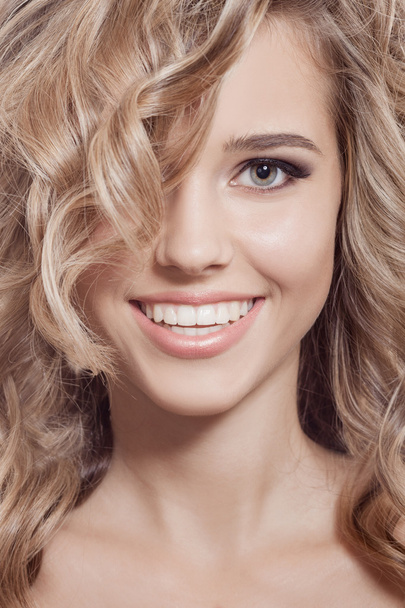 Beautiful Smiling Woman. Healthy Long Curly Hair - Photo, image