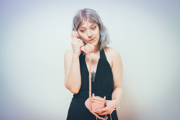 Woman Talking On Landline Telephone, Indoors - Foto, Bild