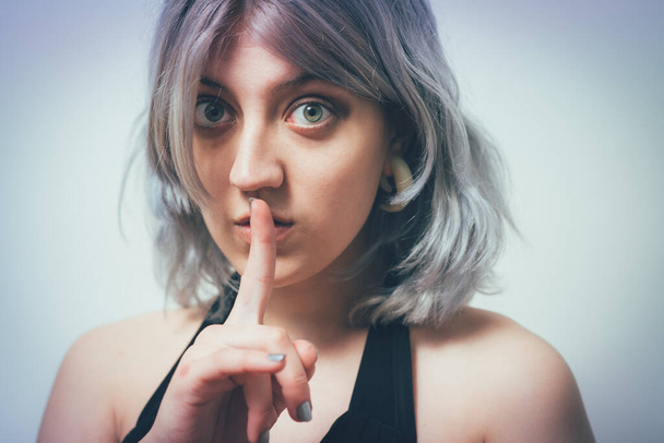 woman put finger on her lips - Photo, image