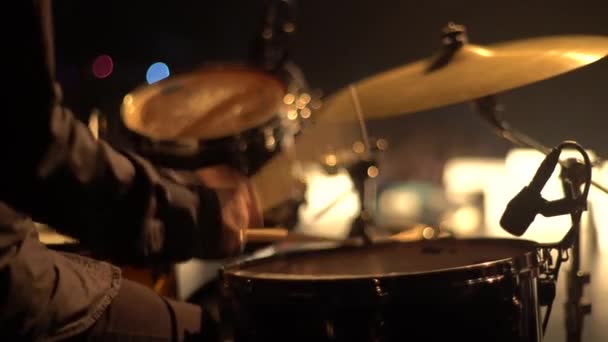 Male man drummer playing drums on stage close-up . Kyiv. Ukraine - Filmati, video