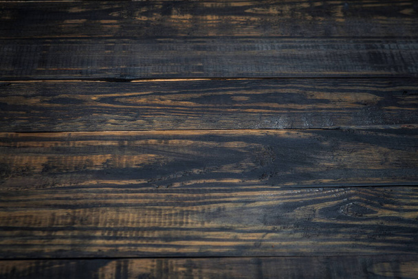 Wooden dark textured background. Natural wood planks. - 写真・画像