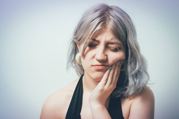 Toothache woman against studio background - Photo, Image