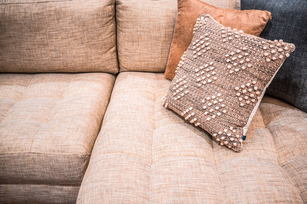 Beige pillows and textile couch closeup - interior design - Foto, Bild