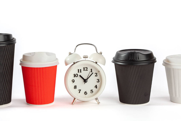 Coffee time concept with vintage alarm clock and disposable coffee cups on white background with copy space - Foto, imagen