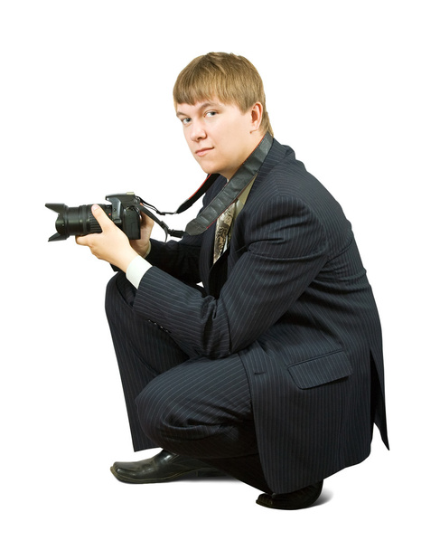Businessman with camera - Foto, afbeelding