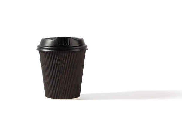 Black plastic coffee cup with lid isolated on white background with copy space - Φωτογραφία, εικόνα