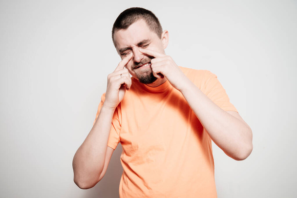 man crying against studio background - Fotoğraf, Görsel