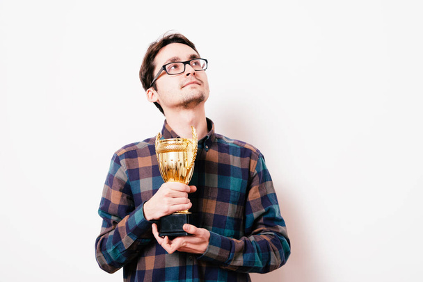 man with a golden cup - Фото, зображення