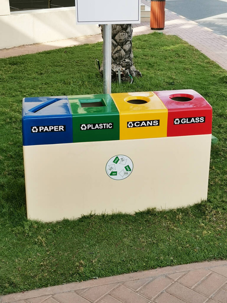 Recycling of garbage separation and recycling concept. Colorful bins for different garbage with sorted garbage vector icons. - Photo, Image