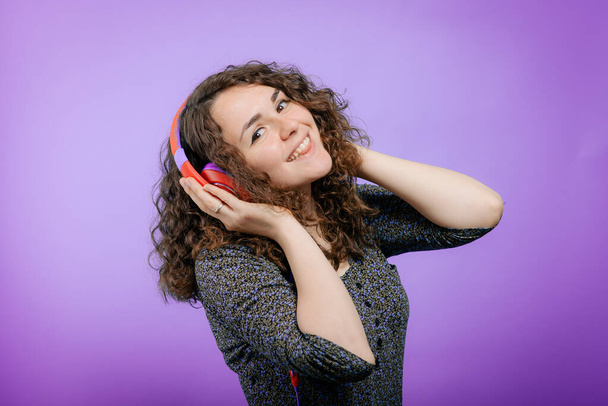Woman with headphones against studio background - Фото, зображення