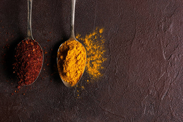 The concept of food photography. Ingredients. Spices on a dark background. Copy space, background image - Foto, Imagen