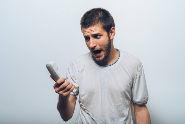 Close up image of a man screaming on the telephone during the conversation. - Zdjęcie, obraz