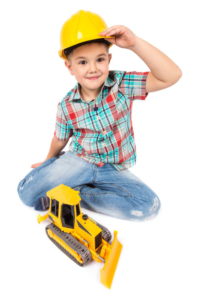 Little boy plays with toy tractor - Фото, зображення