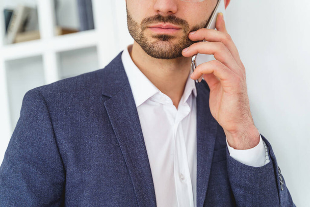 Bearded Caucasian man making a phone call - Photo, image