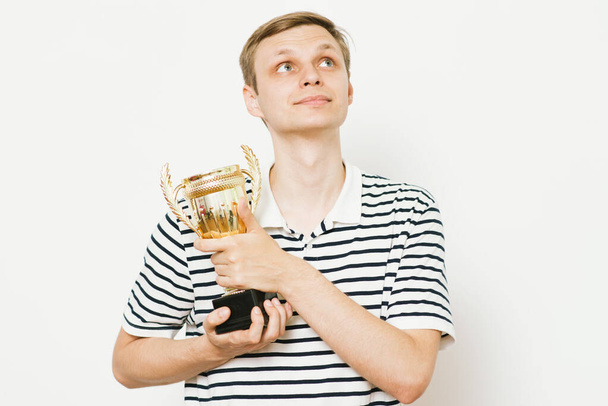 man with a golden cup - Фото, зображення