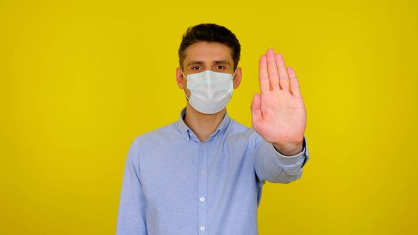Stop virus concept: coronavirus, flu. Man in protective medical mask - Fotó, kép
