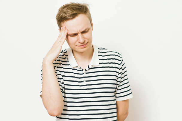 headache in men in photo studio - Foto, imagen