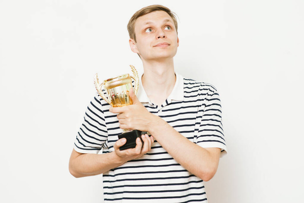 man with a golden cup - Foto, immagini