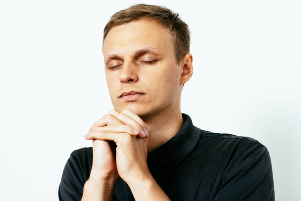 Prayer. Man. in photo studio - 写真・画像