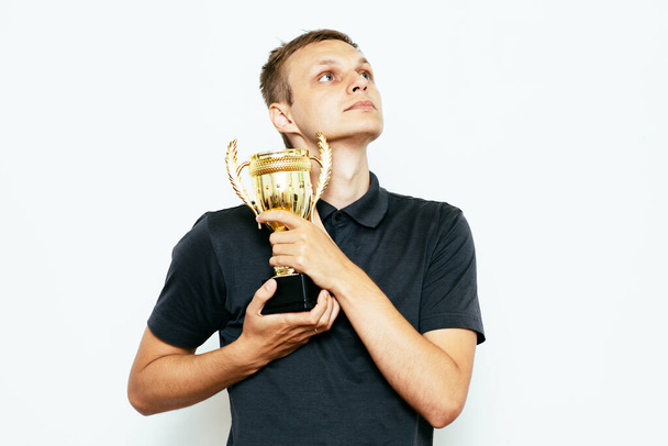 man with a golden cup - Фото, изображение