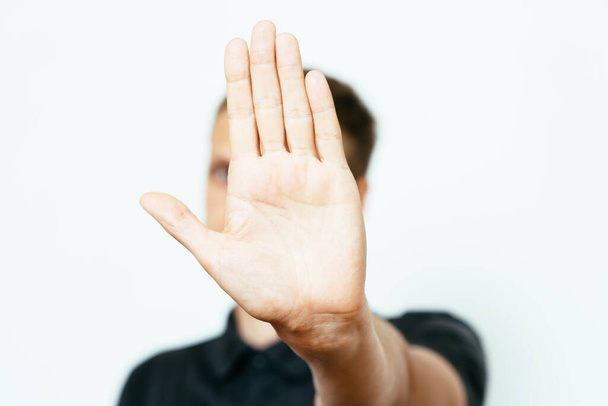Businessman shows stop gesture  - Foto, Imagen