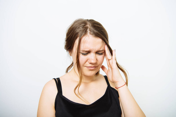 Headache woman in photo studio - Fotó, kép