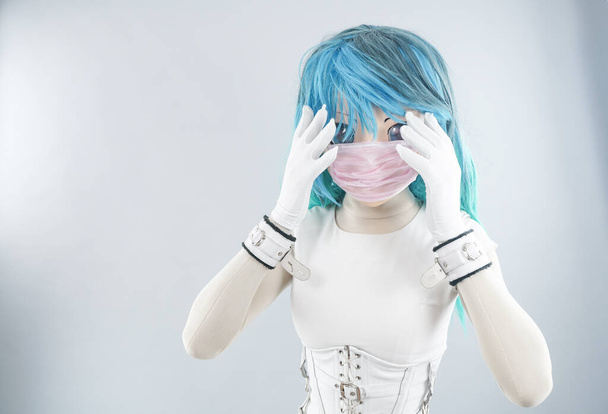 Asian or Chinese cosplay women do not want to have the flu, the colona virus, and she is sick and wears a mask. White Background - Colona Virus. - Фото, зображення