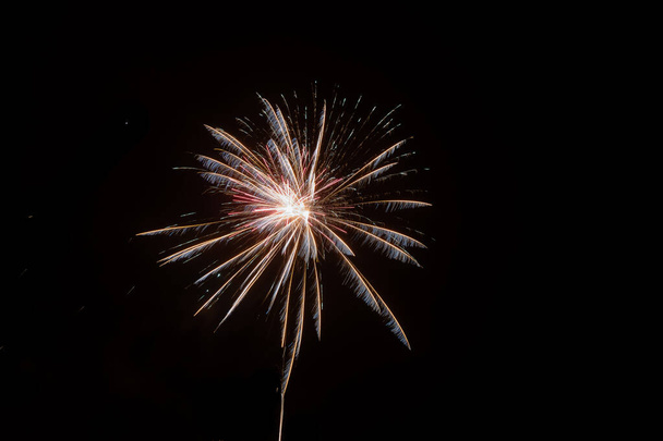 Long exposure of fireworks in the sky. - Foto, afbeelding