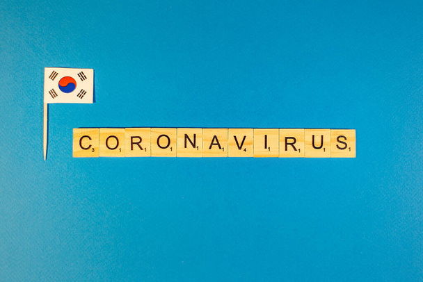 Abstract virus strain model of MERS-Cov or middle East respiratory syndrome coronavirus and Novel coronavirus 2019-nCoV with text on blue background. country flag - 写真・画像