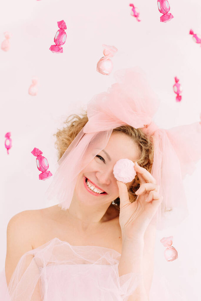 woman holiday candy marshmallows curly hair bow joy - Foto, Imagen