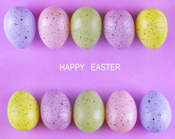 Easter colorful eggs on a pink background, Beautiful bright background, minimalism - Fotó, kép