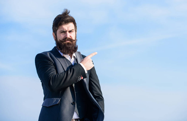 Looking for opportunities and chances. Man formal suit manager looking direction. Developing business direction. Businessman bearded face sky background. Business direction. Changing course. This way - Φωτογραφία, εικόνα
