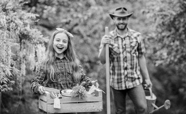 Planting flowers. Phases of moon help determine best time plant garden. Family dad and daughter planting plants. Transplanting vegetables from nursery gardening center. Plant veggies. Planting season - Foto, immagini