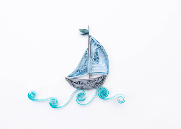 sailboat on the waves Isolated on white background. Hand made of paper quilling technique. - Foto, immagini