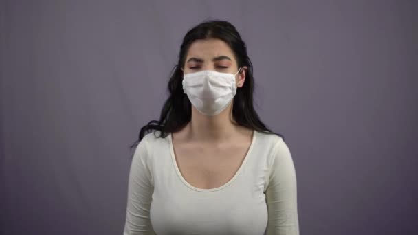 Young woman coughing in medical mask Coronavirus, COVID-19, pandemic - Кадры, видео