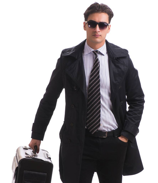 O jovem homem de negócios com mala pronta para viagem de negócios em w
 - Foto, Imagem