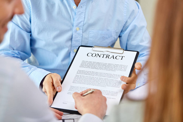 customer signing contract document at office - Valokuva, kuva