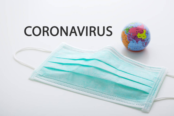 Coronavirus global outbreak with surgical mask corona virus protection and prevention - Foto, Bild