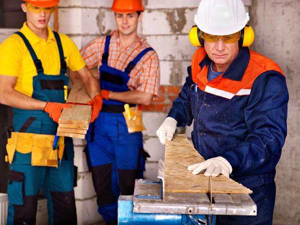 Group people builder with circular saw . - Photo, Image