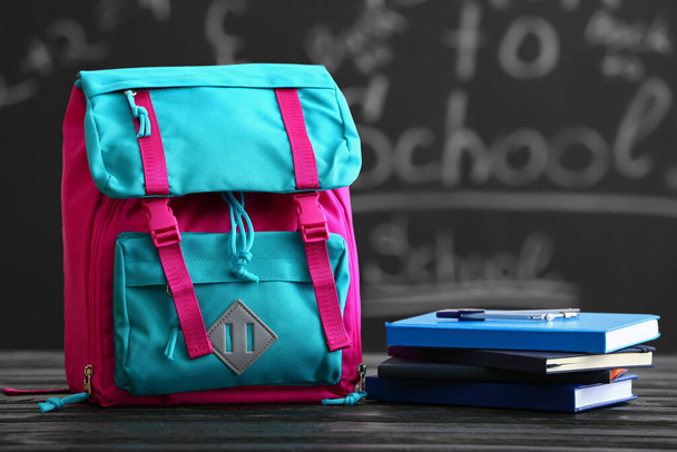 School backpack on table in classroom - Photo, Image